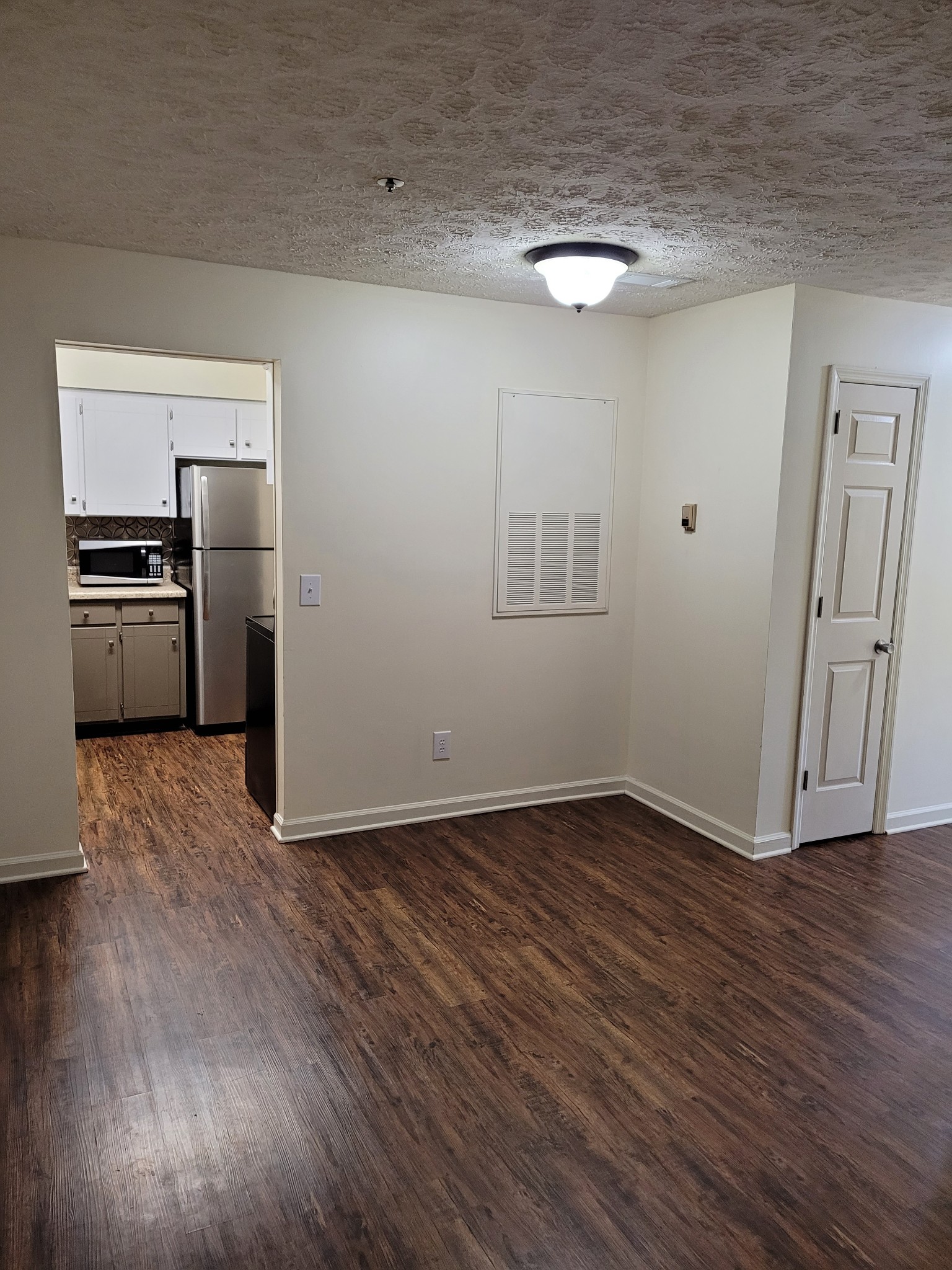 1808 State Street, Unit 307 Nashville, TN 37203 - Photo 3 of 8 a view of a kitchen with a sink stove window and wooden floor