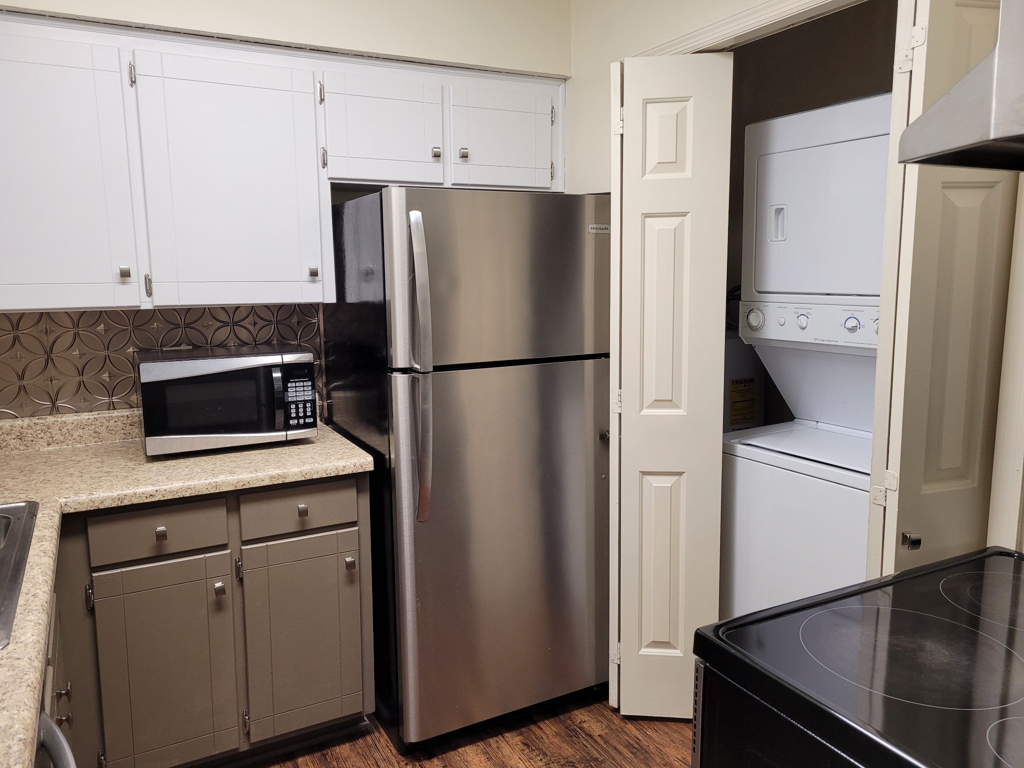 1808 State Street, Unit 307 Nashville, TN 37203 - Photo 4 of 8 a white refrigerator freezer and a stove sitting inside of a kitchen