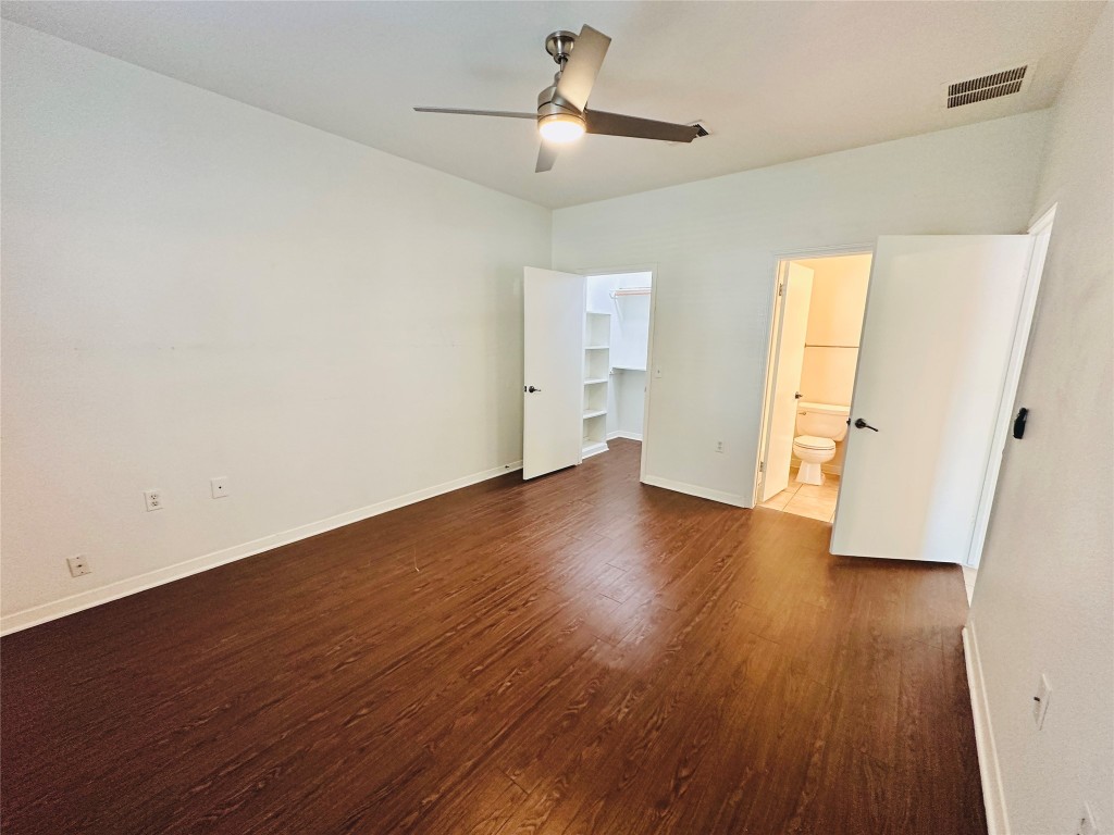 6301 Crumley Lane Austin, TX 78741 - Photo 16 of 39 wooden floor in an empty room with a window