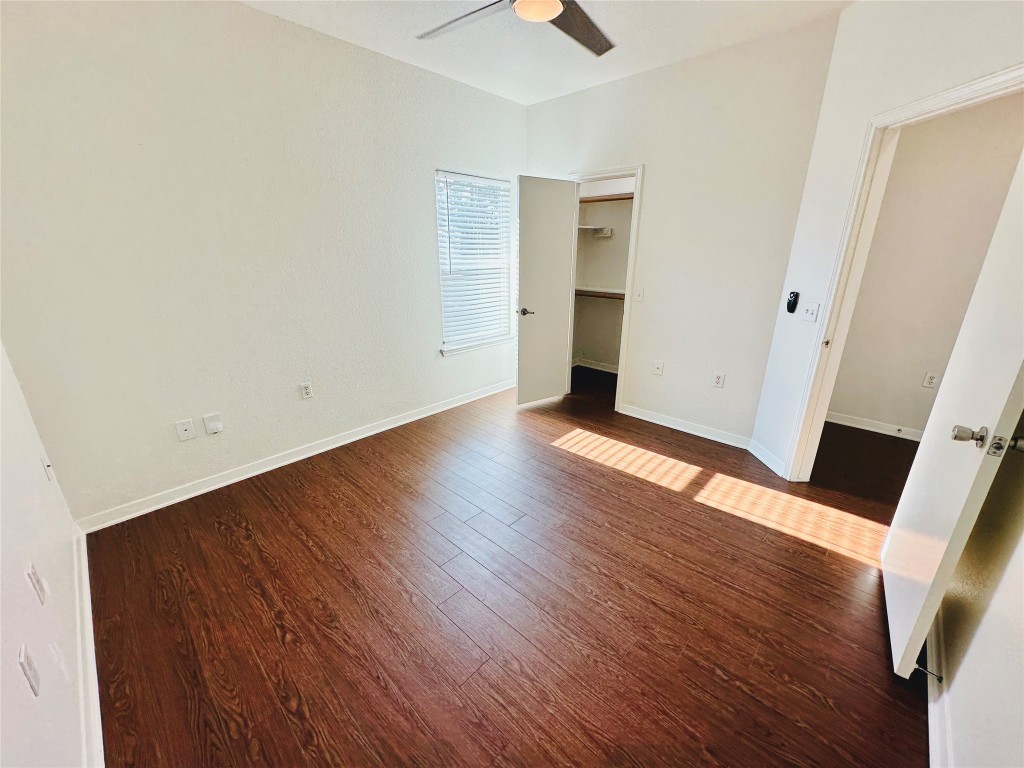 6301 Crumley Lane Austin, TX 78741 - Photo 25 of 39 an empty room with wooden floor and closet