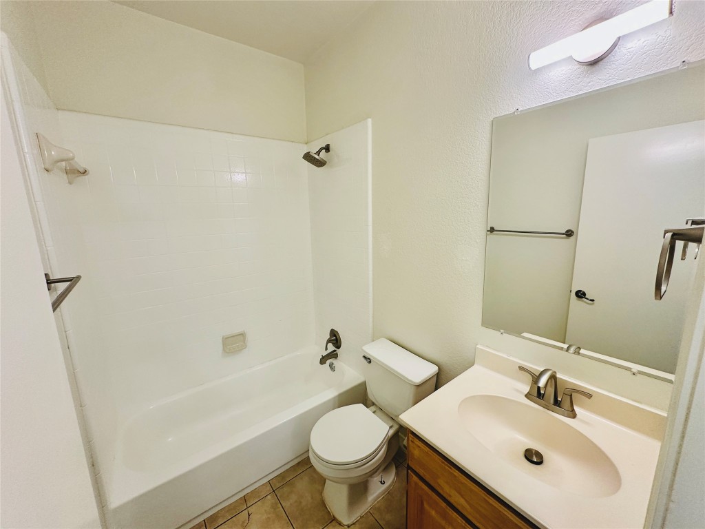 6301 Crumley Lane Austin, TX 78741 - Photo 29 of 39 a bathroom with a sink a toilet and shower