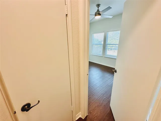 a close view of walk in closet with empty racks