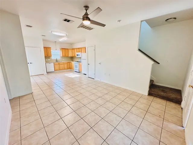 a view of an empty room and a window