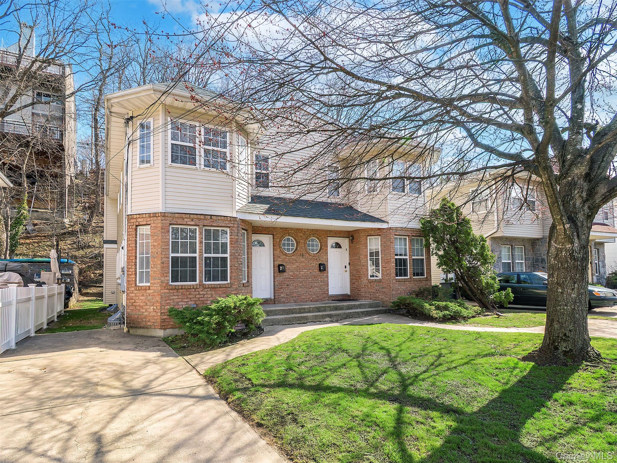 78 B Ashwood Road Port Washington, NY 11050 - Photo 1 of 1 a front view of house with yard and green space