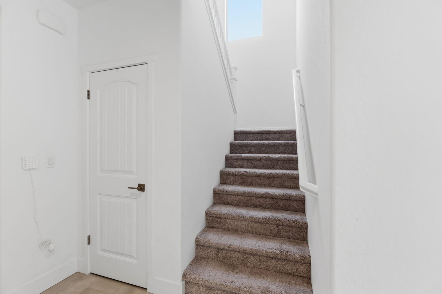 6326 West Richert Avenue Fresno, CA 93723 - Photo 20 of 45 a view of staircase with white walls
