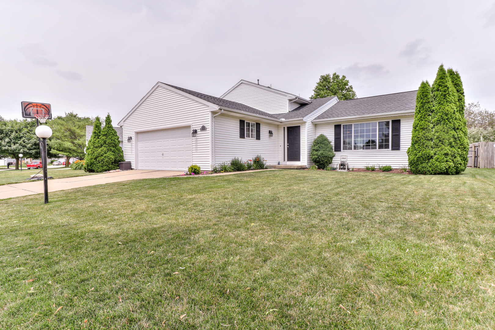3202 Sharon Drive Champaign, IL 61822 - Photo 1 of 37 a house that has a tree in front of it