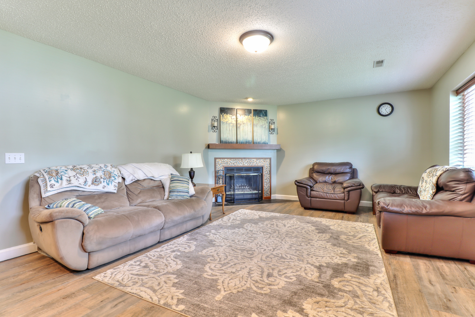 3202 Sharon Drive Champaign, IL 61822 - Photo 21 of 37 a living room with furniture a fireplace and a large window