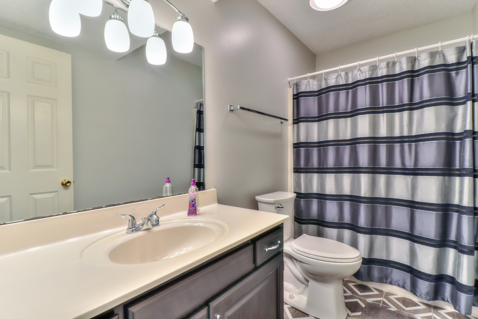 3202 Sharon Drive Champaign, IL 61822 - Photo 26 of 37 a bathroom with a sink a toilet and shower