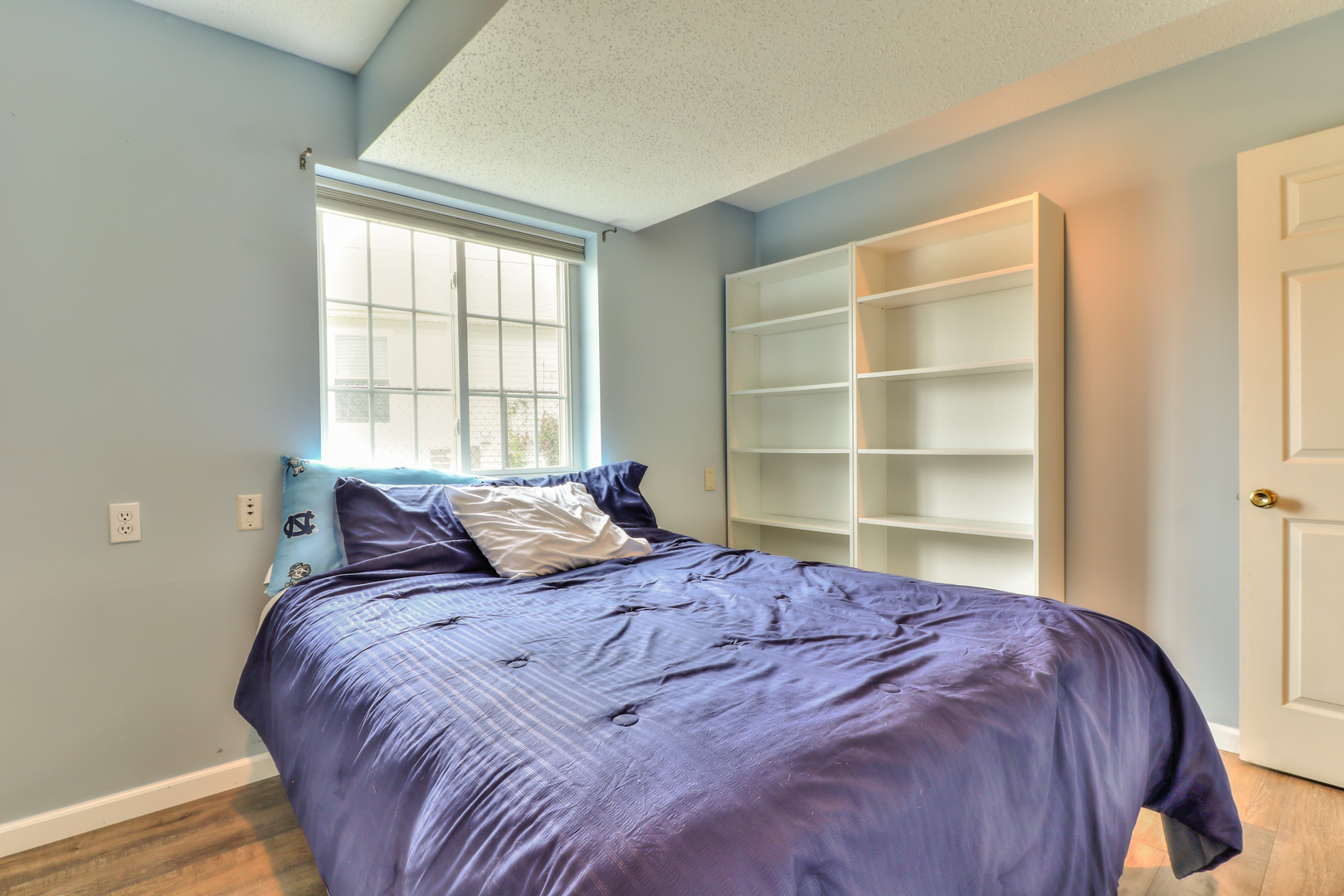 3202 Sharon Drive Champaign, IL 61822 - Photo 28 of 37 a bed sitting in a bedroom next to a window