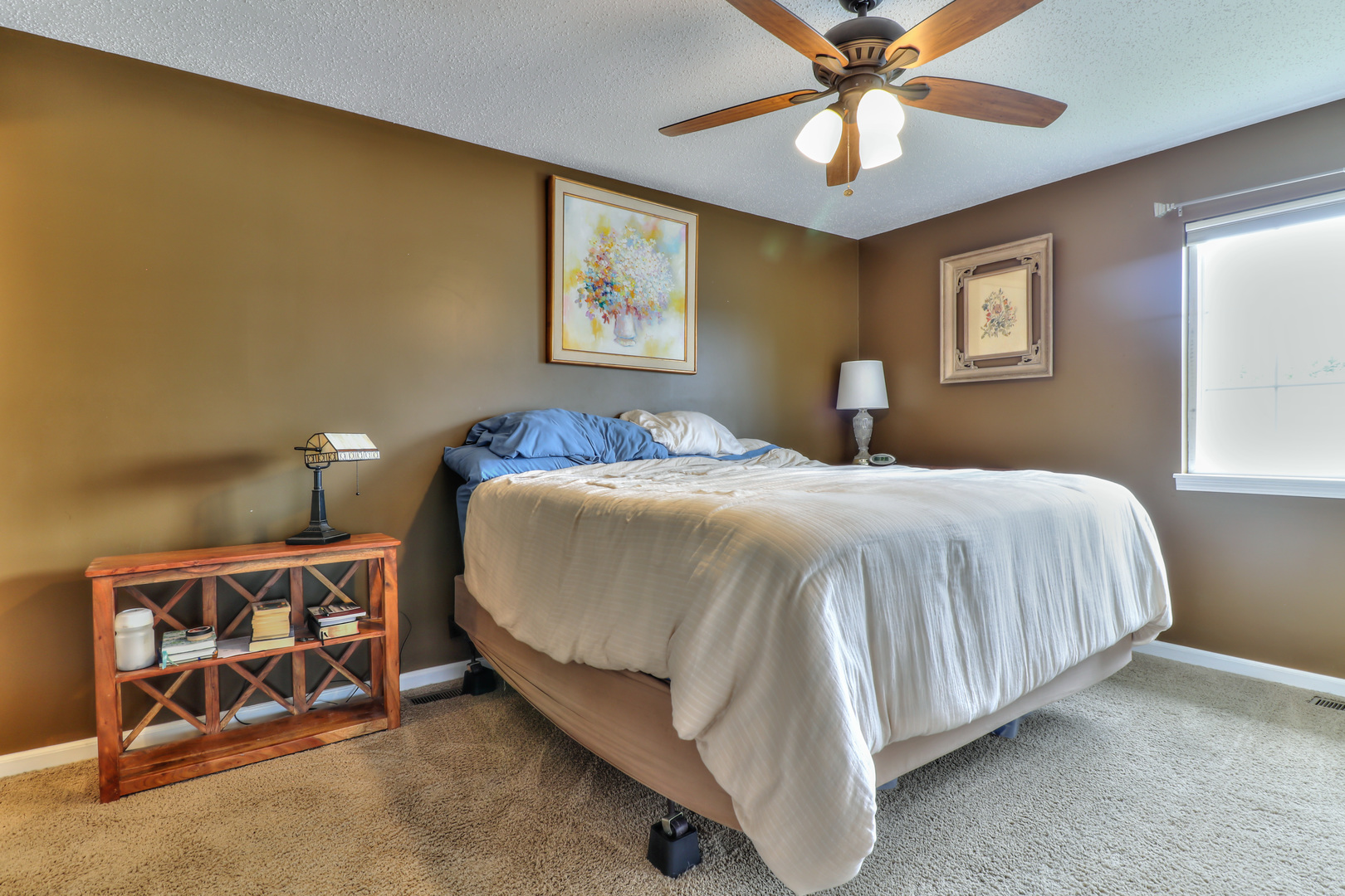 3202 Sharon Drive Champaign, IL 61822 - Photo 30 of 37 a bedroom with a bed and a chandelier