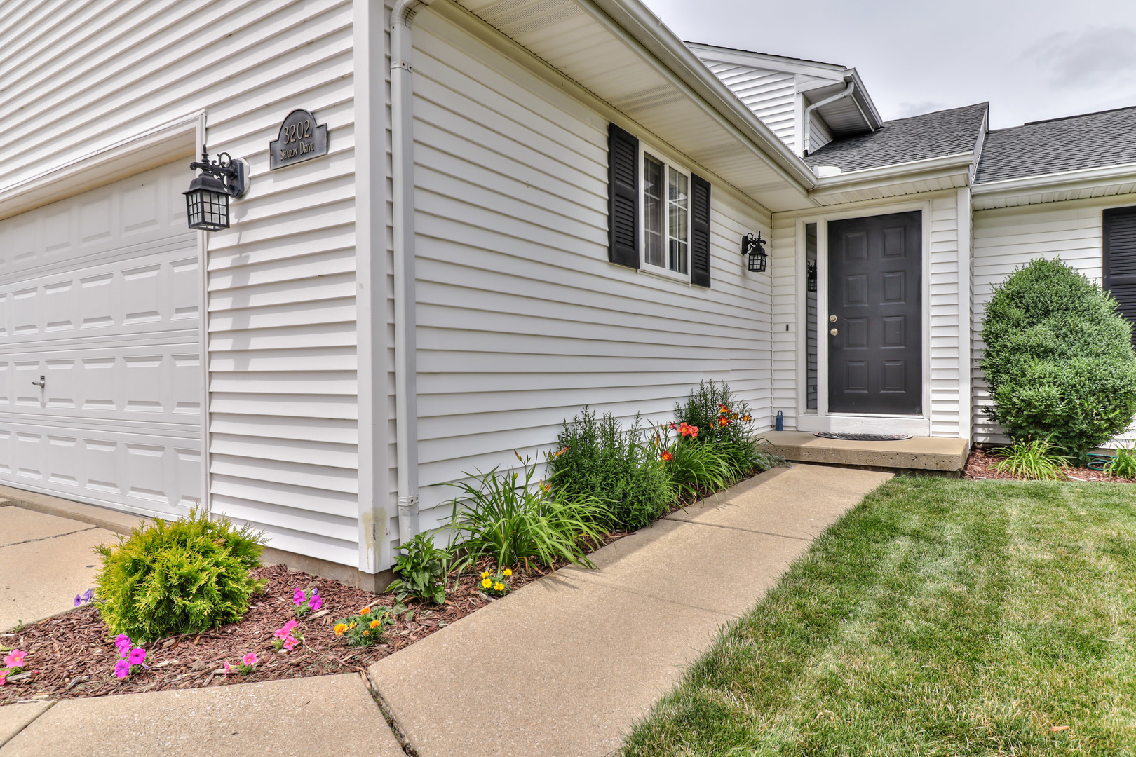 3202 Sharon Drive Champaign, IL 61822 - Photo 4 of 37 a front view of a house with a garden