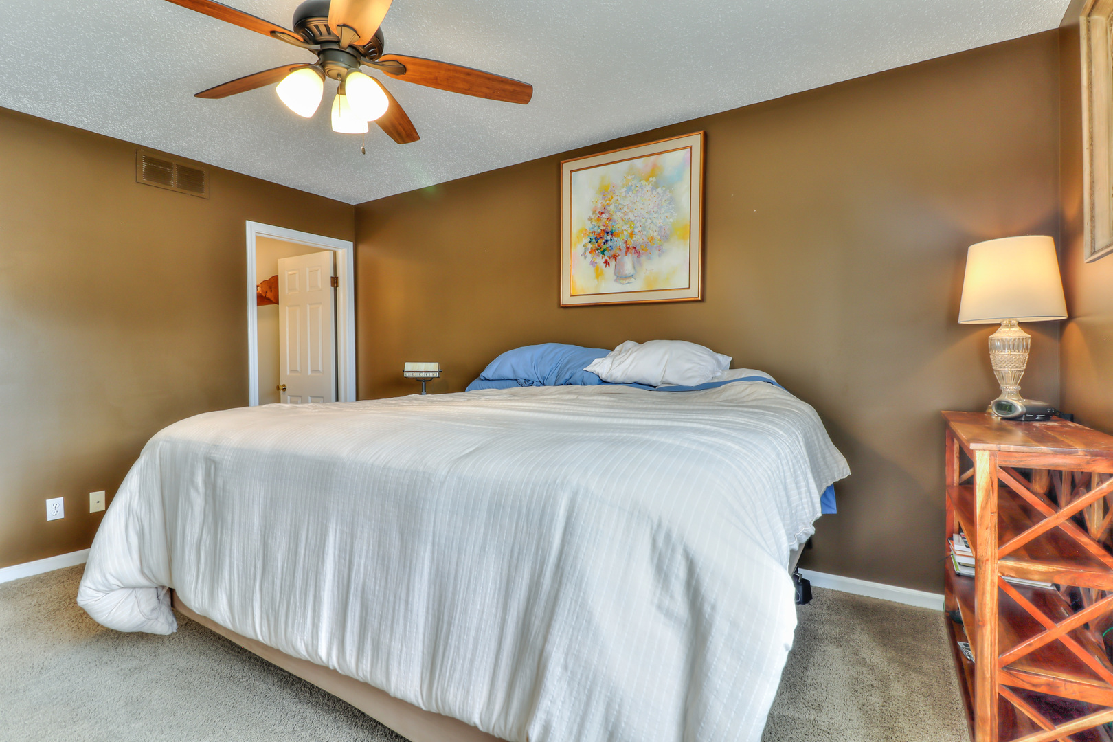 3202 Sharon Drive Champaign, IL 61822 - Photo 31 of 37 a bedroom with a bed and a lamp on table