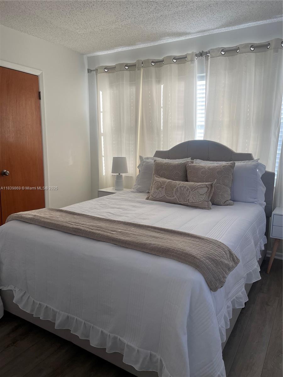 1115 Hernando Street, Unit A Fort Pierce, FL 34949 - Photo 17 of 18 a bedroom with a bed and a window