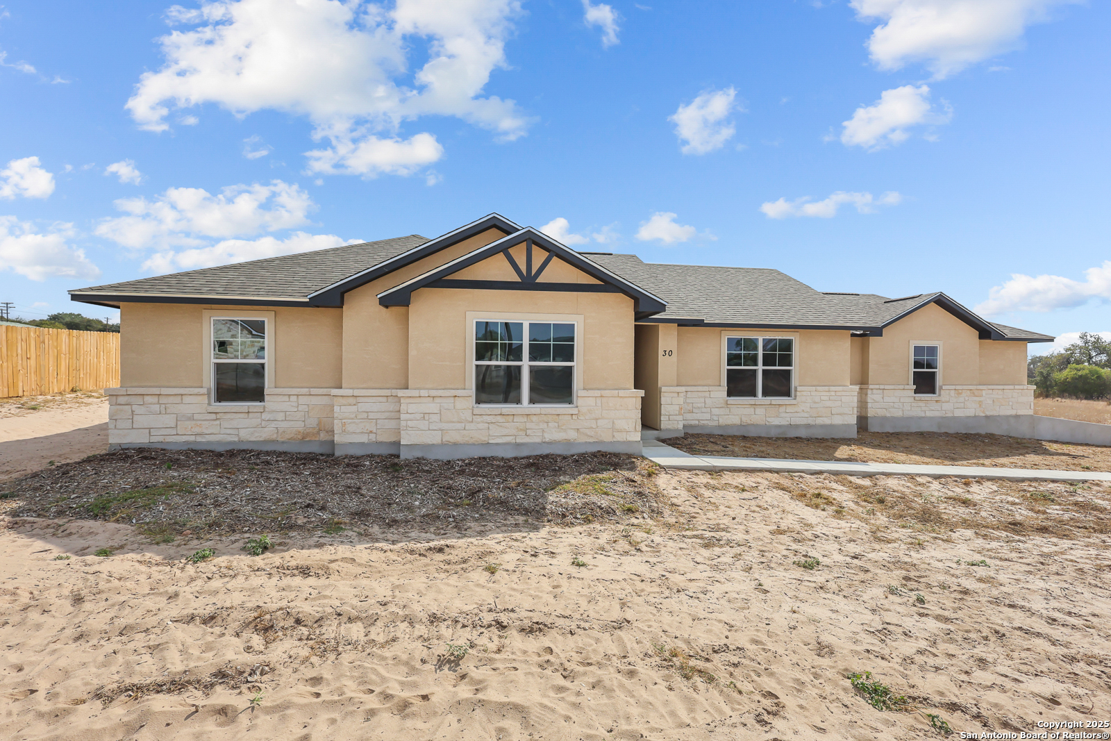 30 Log Cabin Way Poteet, TX 78065 - Photo 2 of 47 a front view of a house with a yard