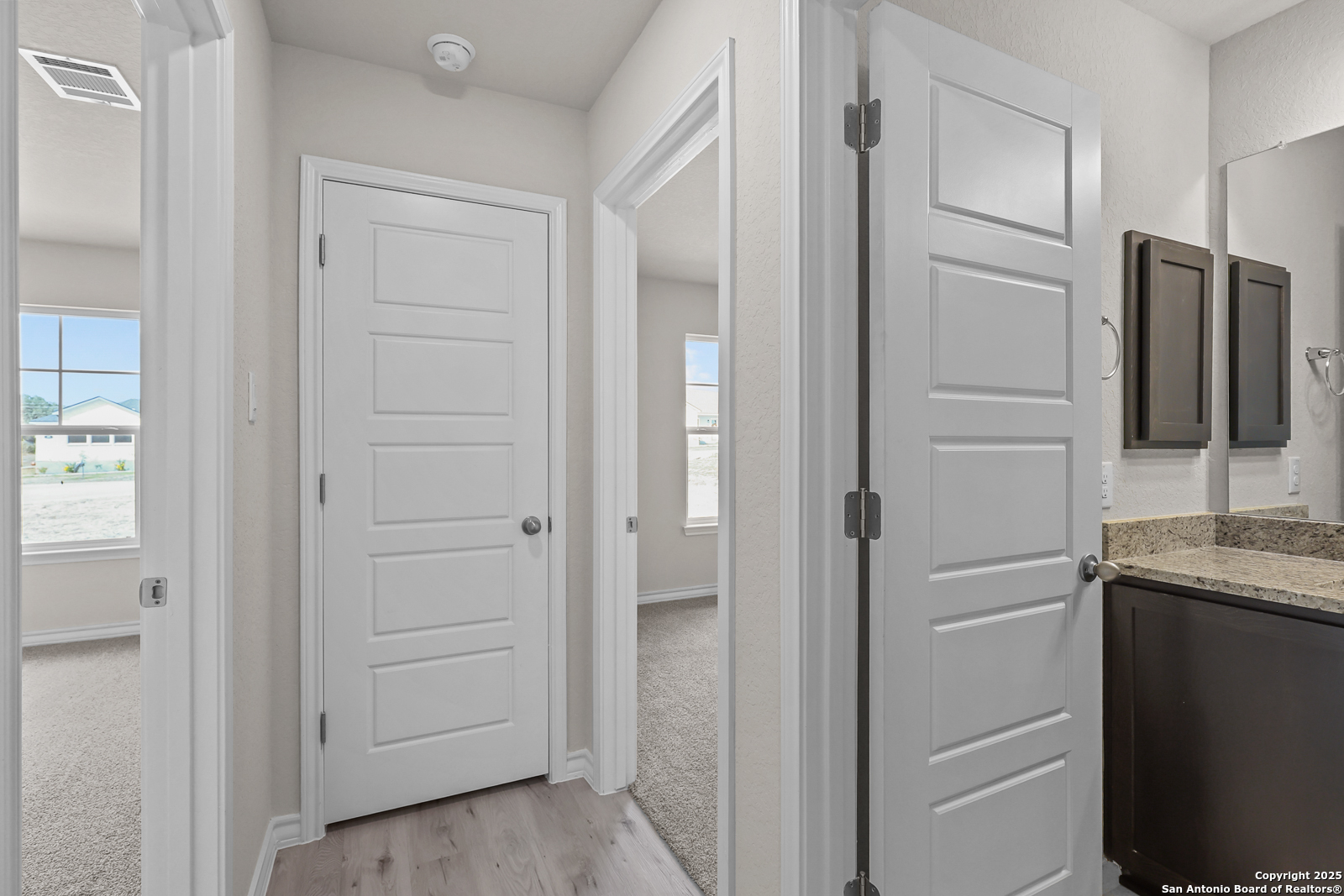 30 Log Cabin Way Poteet, TX 78065 - Photo 27 of 47 a bathroom with a granite countertop sink and a mirror