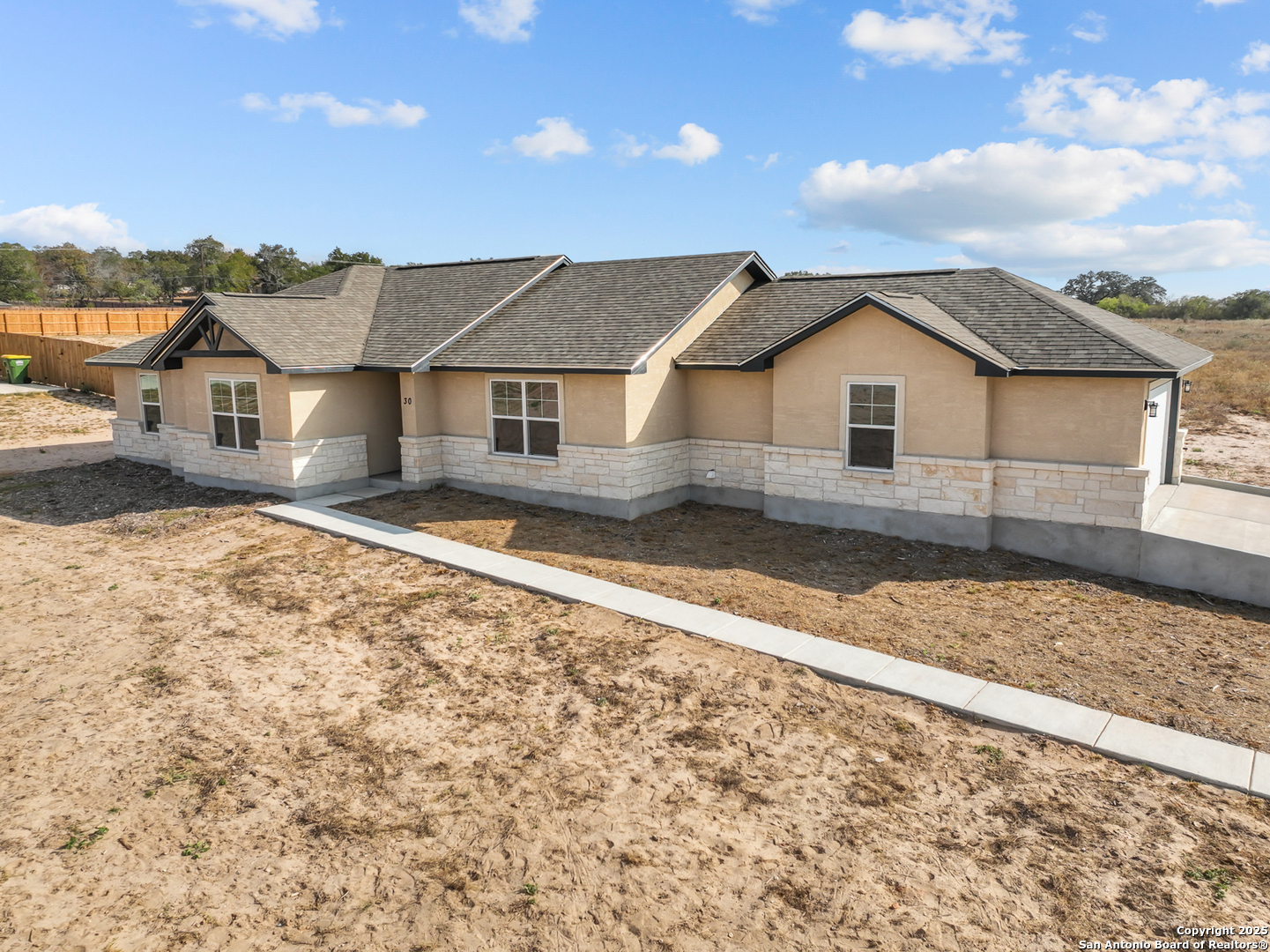 30 Log Cabin Way Poteet, TX 78065 - Photo 40 of 47 front view of a house with a yard
