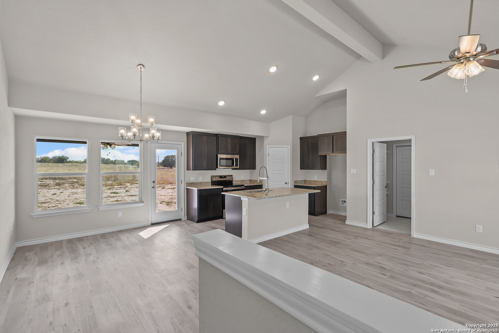 30 Log Cabin Way Poteet, TX 78065 - Photo 5 of 47 a large kitchen with a large counter top appliances and cabinets