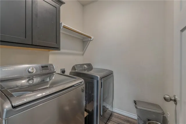a bathroom with a granite countertop sink a toilet and bathtub