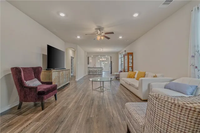 a backyard of a house with a garden and barbeque oven
