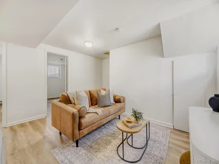 a living room with furniture and a rug
