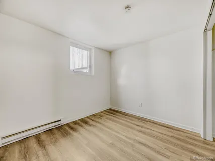 an empty room with a empty space and a window