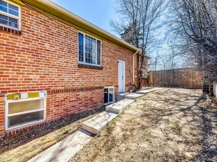a view of a backyard with a house