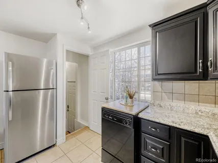 a kitchen with a sink and a refrigerator