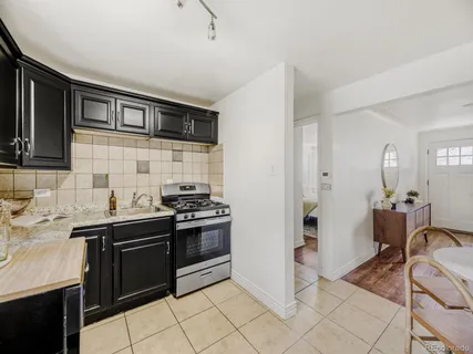a kitchen with stainless steel appliances granite countertop a stove and a sink