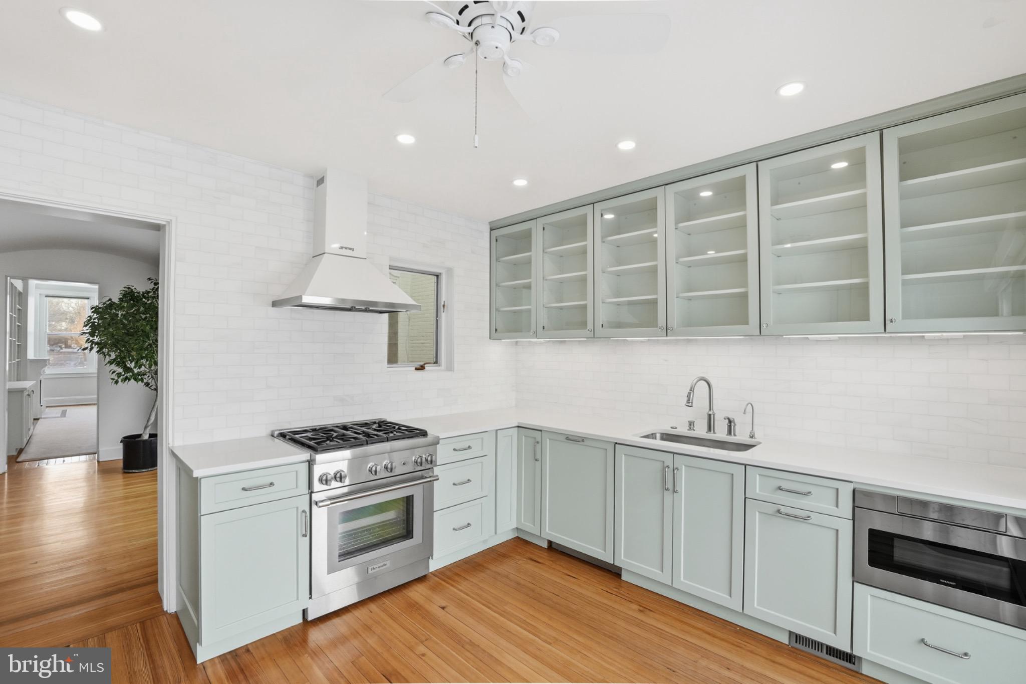 1635 35th Street Northwest Washington, DC 20007 - Photo 11 of 27 a kitchen with a sink stainless steel appliances and cabinets