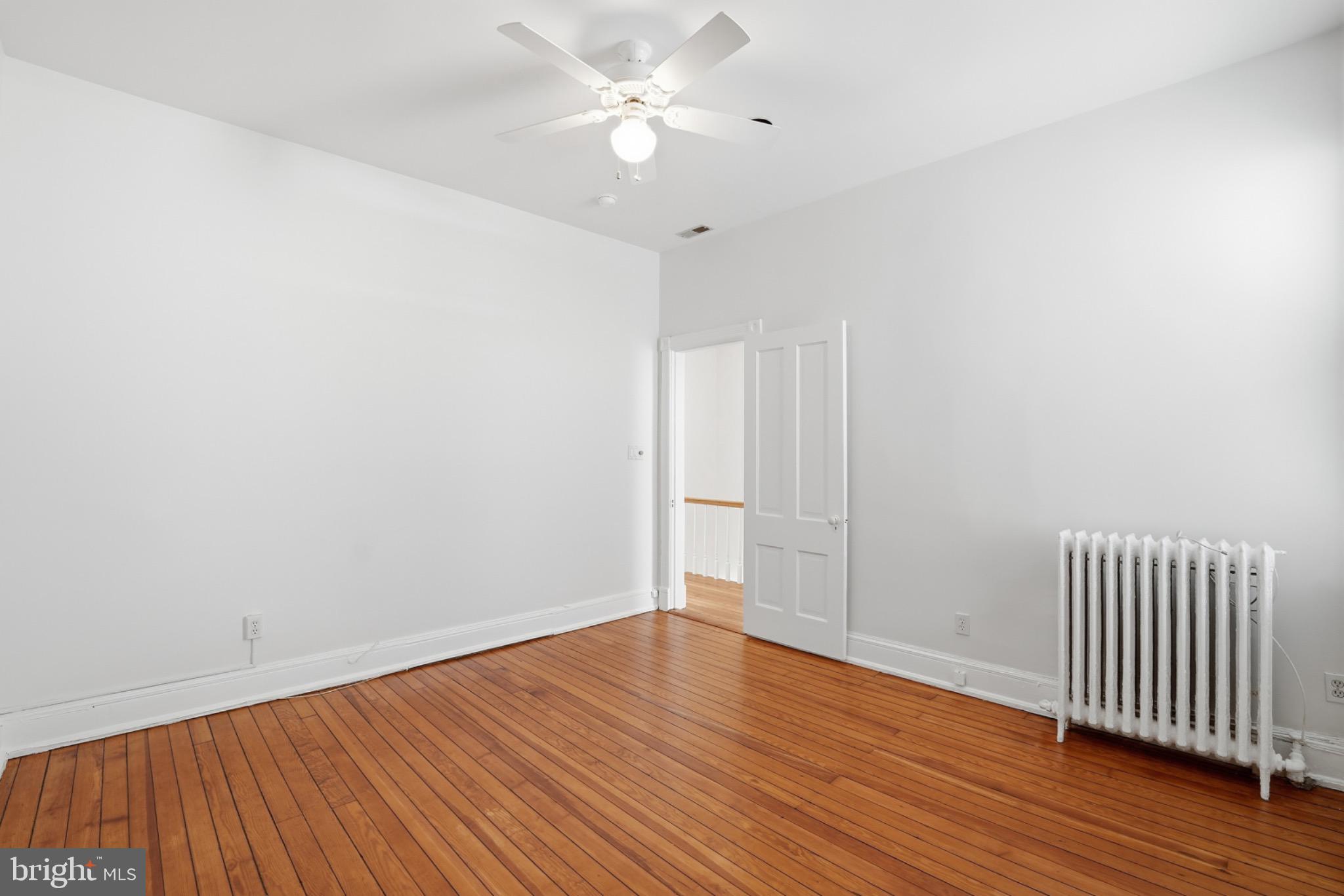 1635 35th Street Northwest Washington, DC 20007 - Photo 15 of 27 wooden floor in an empty room