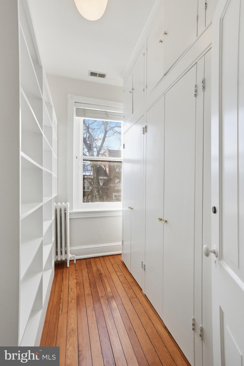 1635 35th Street Northwest Washington, DC 20007 - Photo 22 of 27 a view of wooden floor in a room