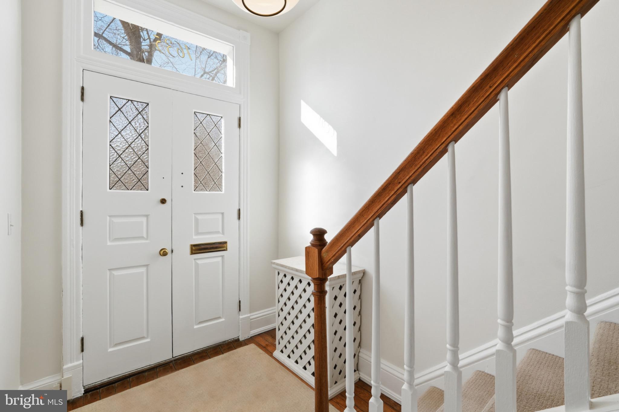 1635 35th Street Northwest Washington, DC 20007 - Photo 3 of 27 a view of staircase with railing and white walls