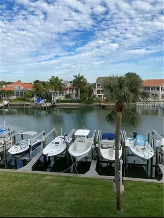 a view of a lake with houses in the back