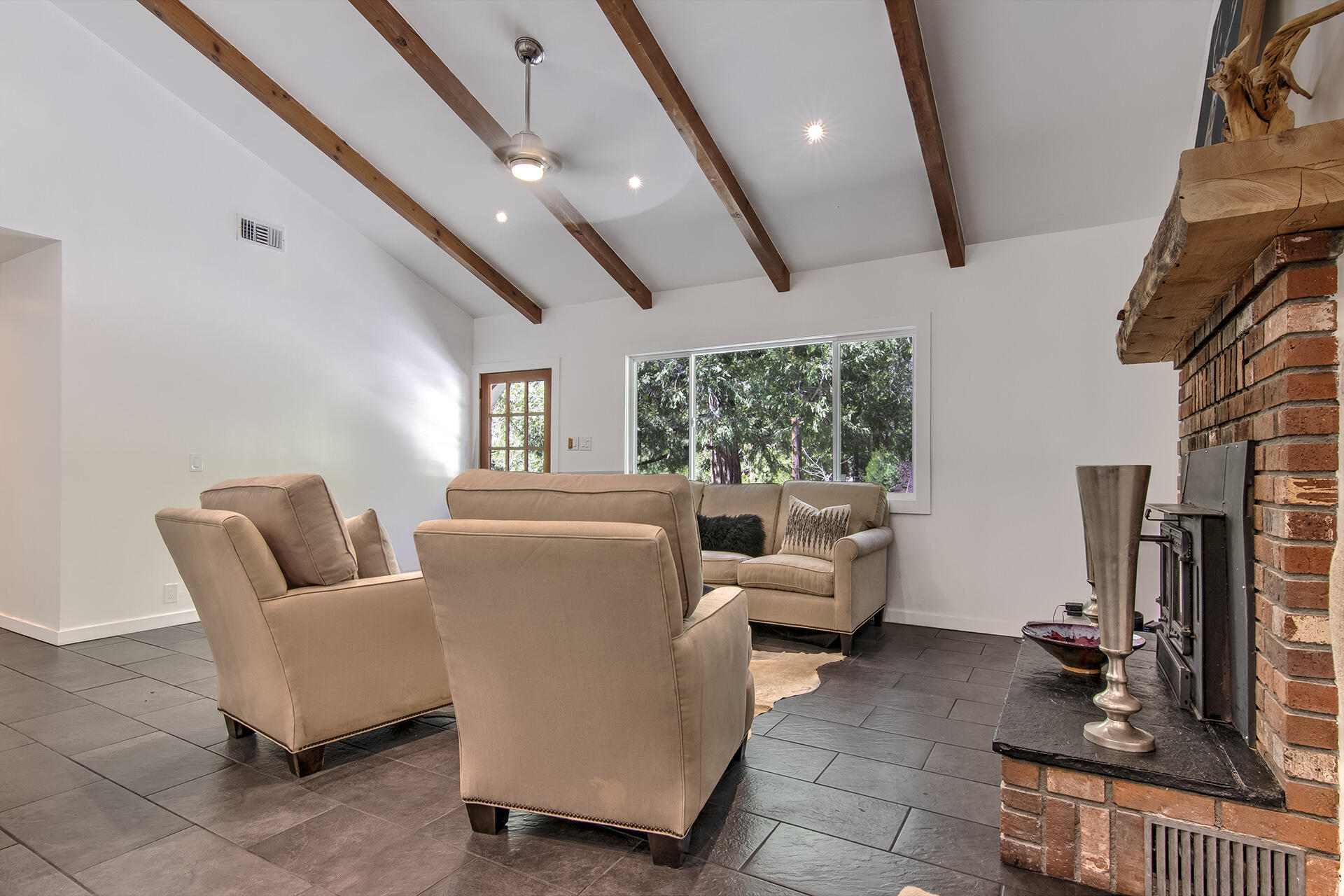 25106 Rim Rock Road Idyllwild, CA 92549 - Photo 13 of 90 a living room with furniture and a flat screen tv