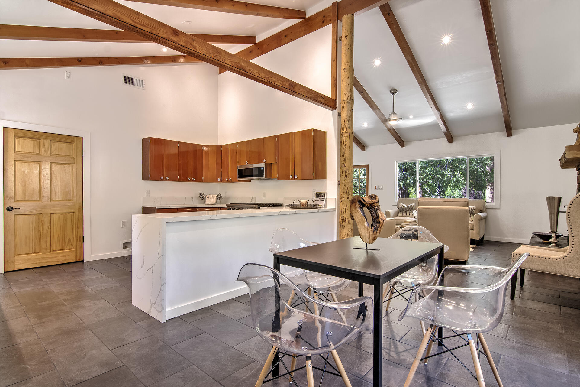 25106 Rim Rock Road Idyllwild, CA 92549 - Photo 18 of 90 a view of a dining room with furniture and wooden floor