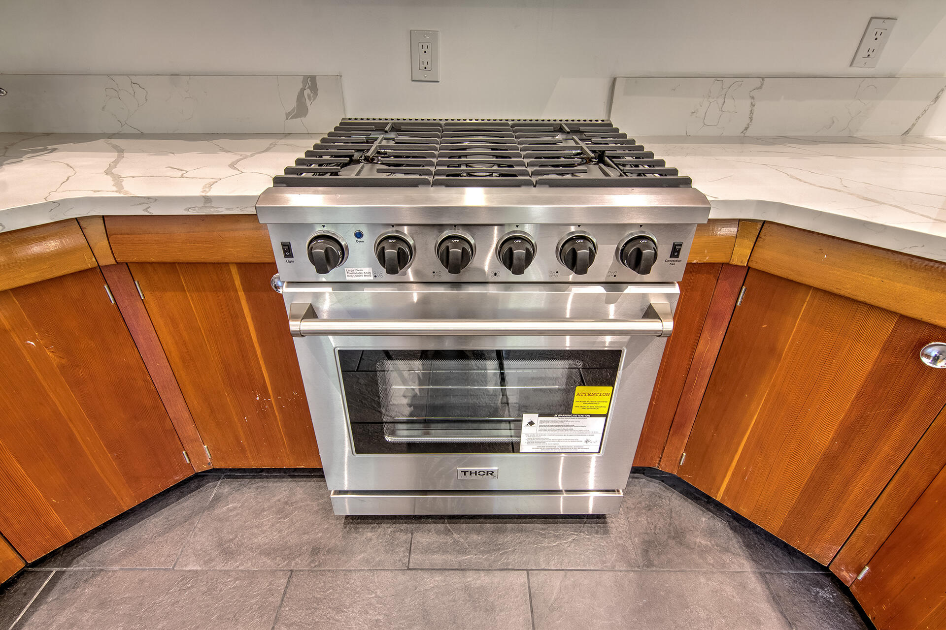 25106 Rim Rock Road Idyllwild, CA 92549 - Photo 22 of 90 a stove top oven sitting inside of a kitchen
