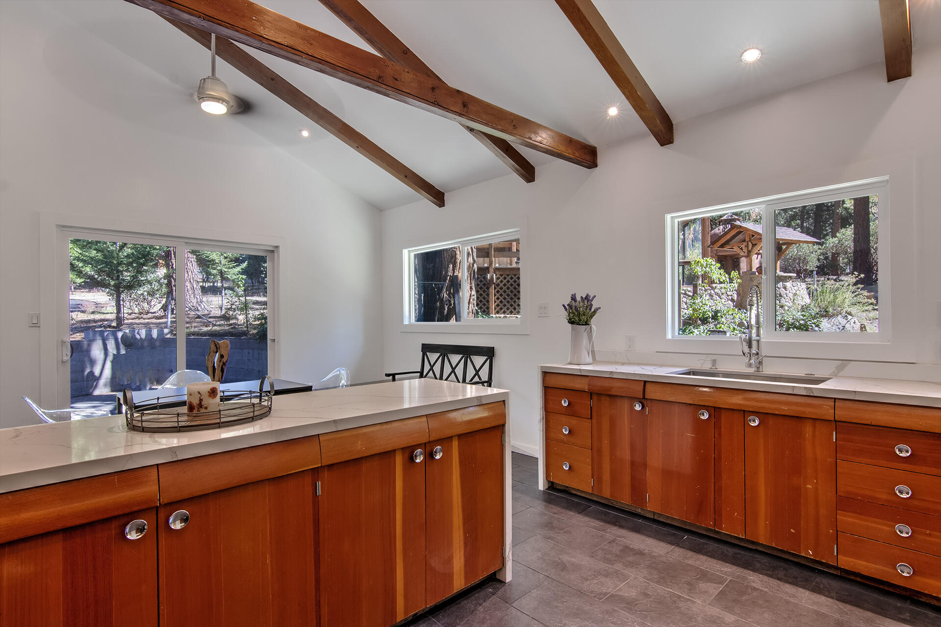 25106 Rim Rock Road Idyllwild, CA 92549 - Photo 25 of 90 a kitchen with stainless steel appliances a sink stove and cabinets