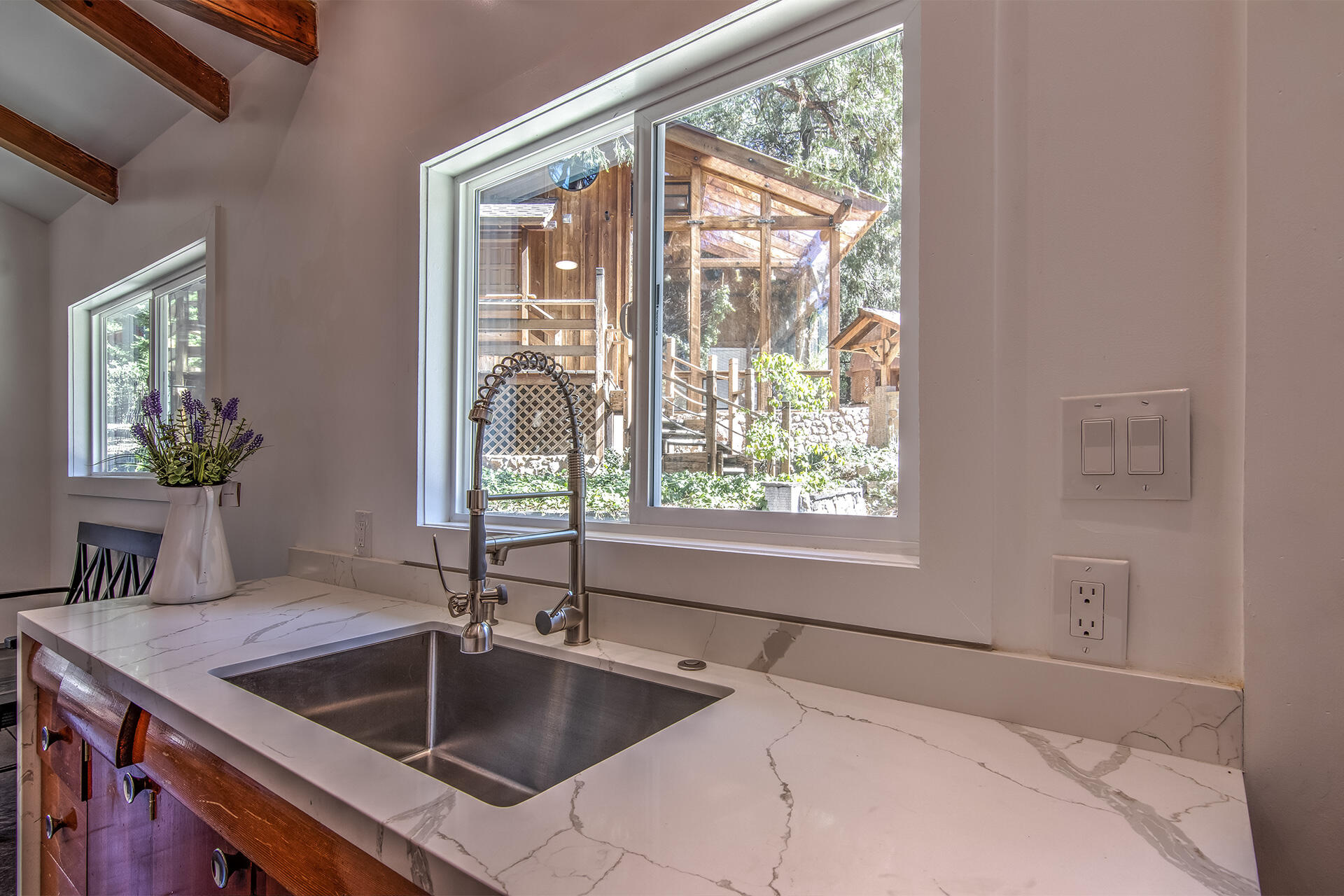 25106 Rim Rock Road Idyllwild, CA 92549 - Photo 26 of 90 a kitchen that has a sink and a large window