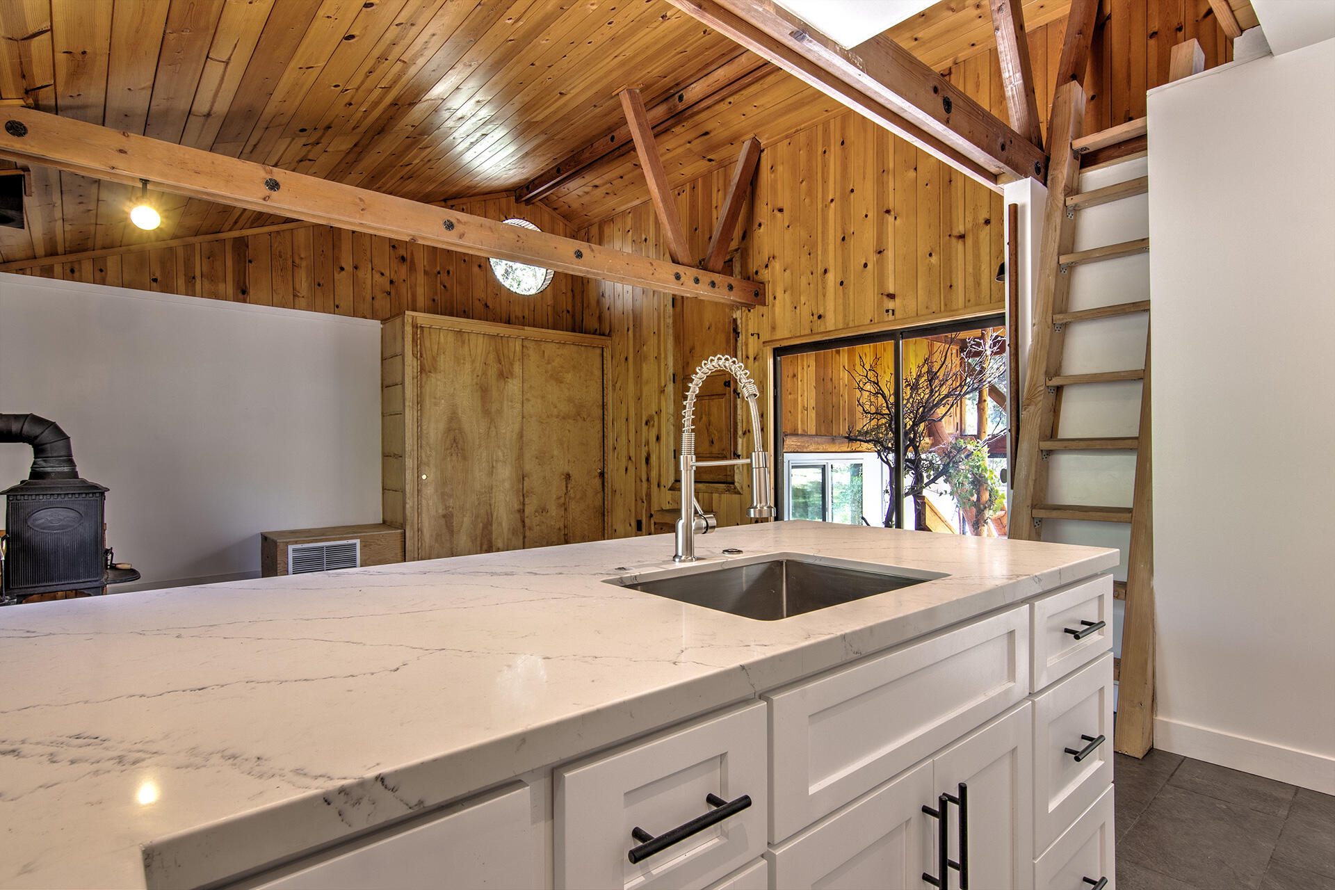 25106 Rim Rock Road Idyllwild, CA 92549 - Photo 57 of 90 a view of a bathroom with a sink and large mirror