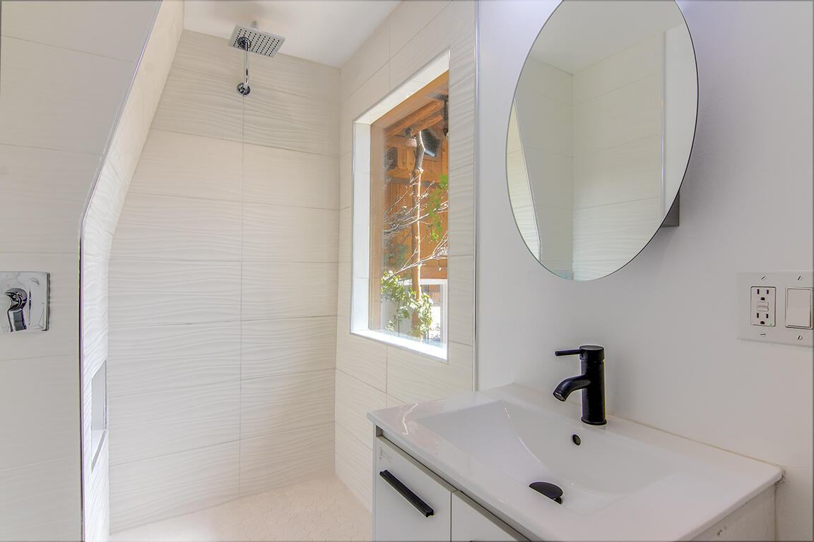25106 Rim Rock Road Idyllwild, CA 92549 - Photo 58 of 90 a bathroom with a sink and a mirror