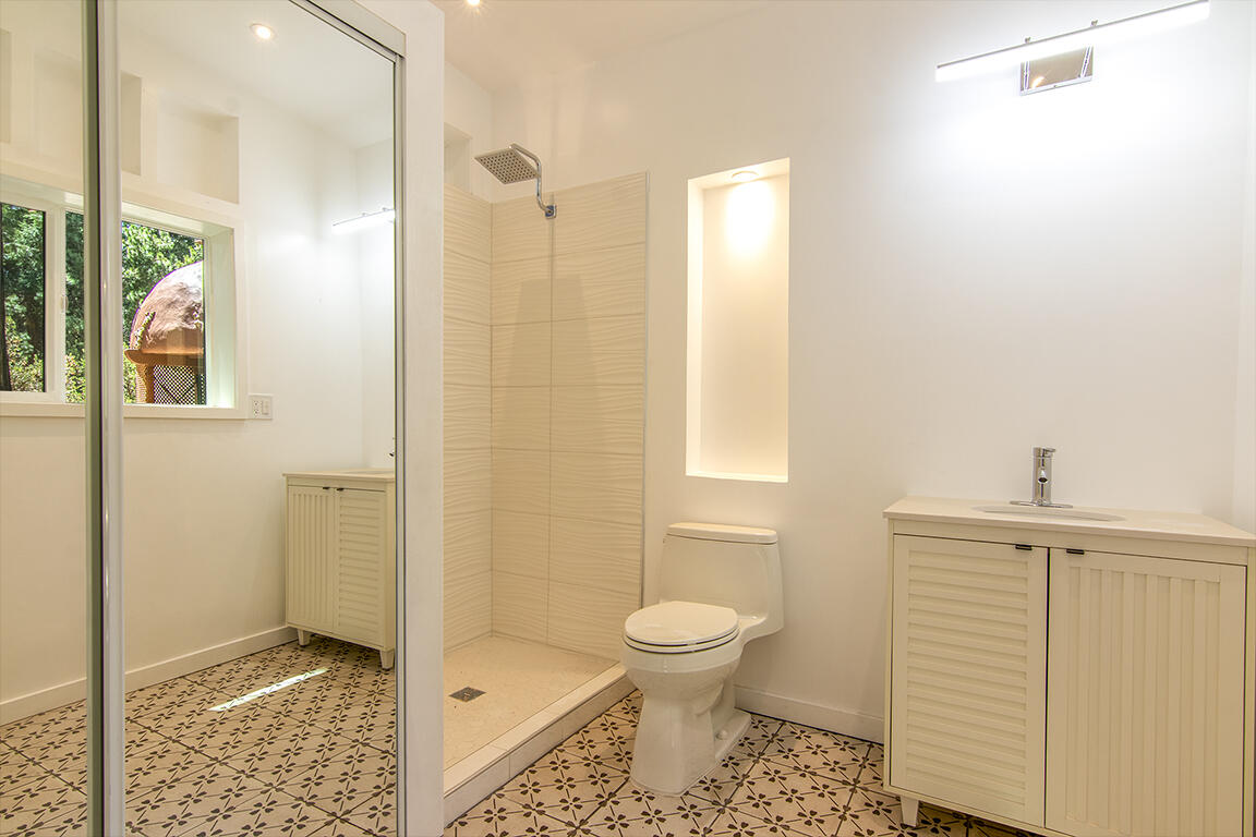 25106 Rim Rock Road Idyllwild, CA 92549 - Photo 76 of 90 a bathroom with a toilet and a shower