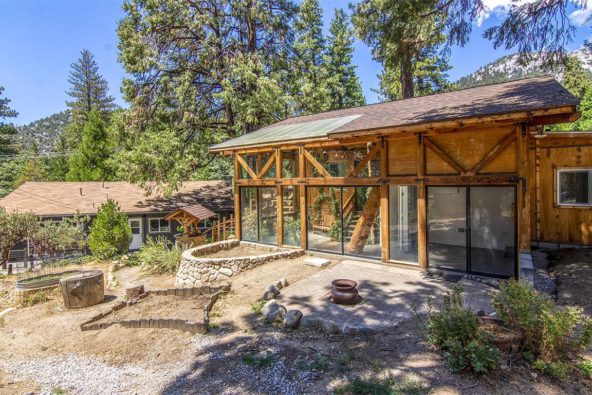 25106 Rim Rock Road Idyllwild, CA 92549 - Photo 78 of 90 a view of a house with backyard and sitting area