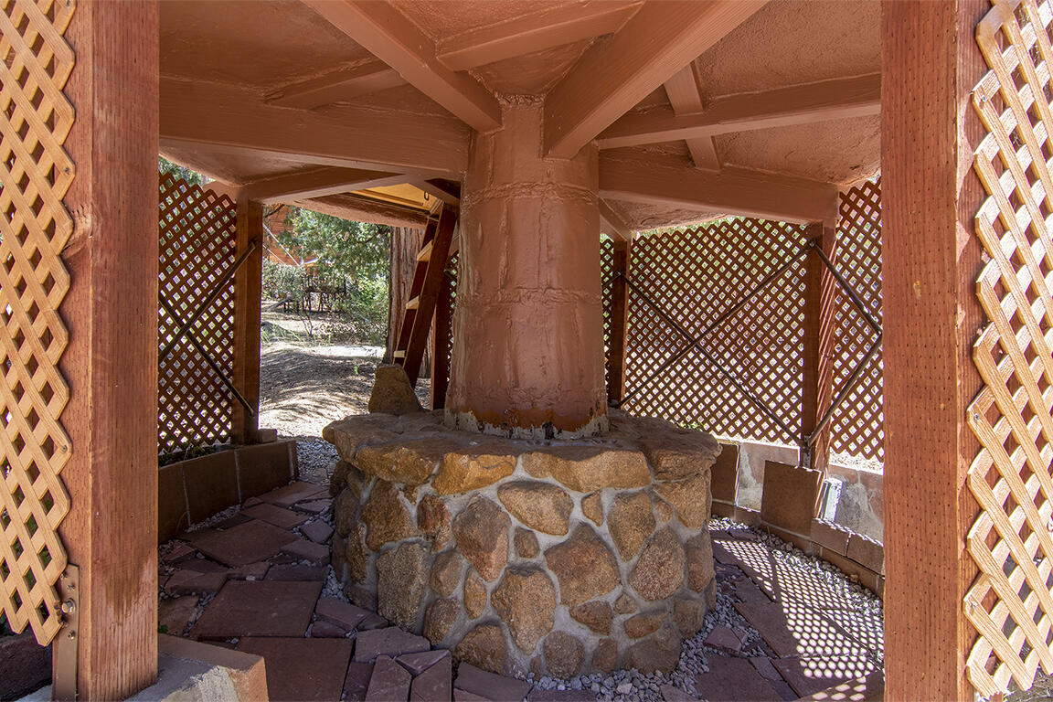 25106 Rim Rock Road Idyllwild, CA 92549 - Photo 80 of 90 a bedroom with a bed and a window