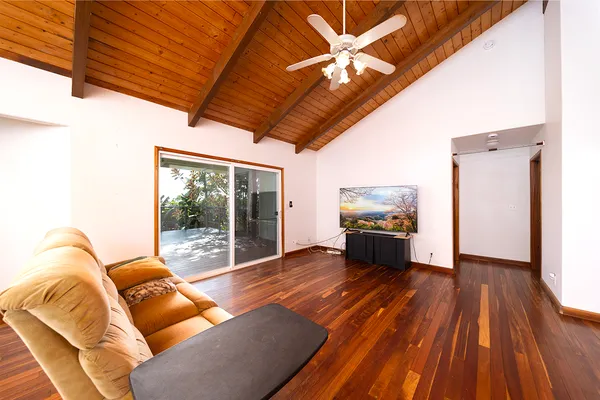 a view of a room with wooden floor