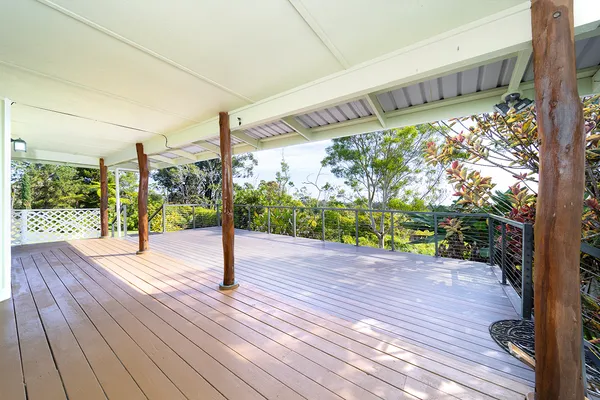 a view of balcony with wooden floor