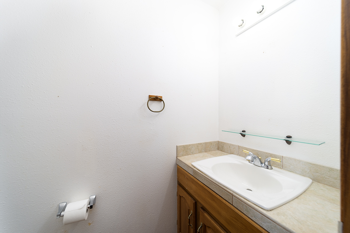 25-3301 Pakelekia Street Hilo, HI 96720 - Photo 18 of 30 a bathroom with a sink and a mirror