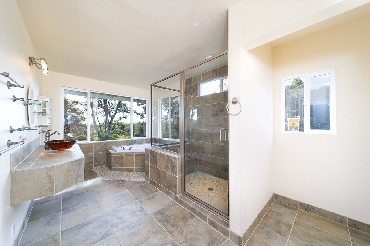 25-3301 Pakelekia Street Hilo, HI 96720 - Photo 21 of 30 a bathroom with a tub shower and sink