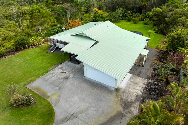 an aerial view of a house with a garden