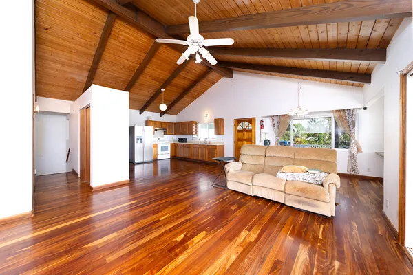 a view of a room with wooden floor