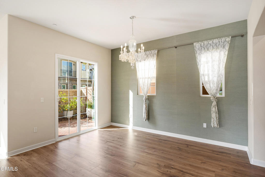 1655 Range Road Oxnard, CA 93036 - Photo 11 of 33 a view of an empty room with wooden floor and a window
